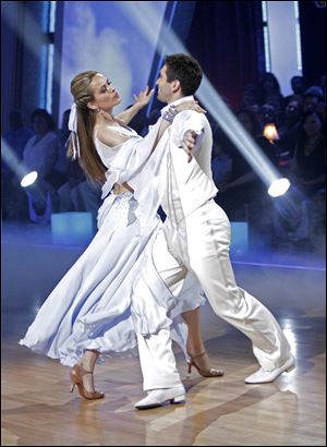Petra Nemcova, left, and her partner Dmitry Chaplin perform on the celebrity dance competition series, 'Dancing with the Stars.'