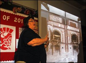 Karen Zillgitt presents a slide show of the incinerators at Dachau.