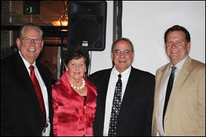 From left, John Irwin, chief financial officer; executive director Marcia Langenderfer, board president Tony Thiros, and honorary chairman Marty Connors of Brooks Insurance at the VANtastic Fundraiser for St. Paul's Community Center.