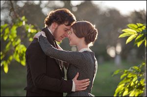 Michael Fassbender as Rochester, left, and Mia Wasikowska as Jane Eyre star in the romantic drama.