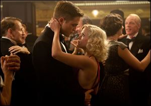 Robert Pattinson, left, and Reese Witherspoon dance as Jacob and Marlena in 'Water for Elephants.'