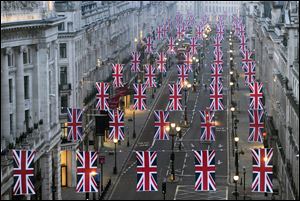 Union Jack flags bedeck Regent Street in London as the city gets ready for next week's royal wedding.