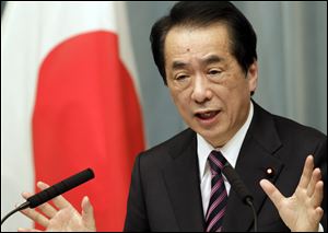 Japanese Prime Minister Nato Kan speaks Friday during a press conference in Tokyo.