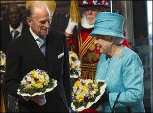 Britain's Queen Elizabeth II, celebrating her 85th birthday, and her husband, Prince Phillip, who will turn 90 in June, take part the traditional Royal Maundy Service at Westminster Abbey.