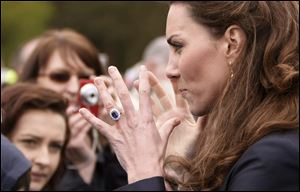 Kate Middleton talks with well-wishers in the crowd at Witton County Park, Darwen, England, when she and fiance Prince William visited local youth charities.