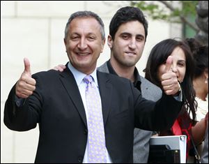 MGA chief executive Isaac Larian, left,  celebrates a victory over Mattel Inc. outside of federal court in Santa Ana, Calif., Thursday.