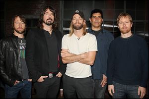 The Foo Fighters, from left, Chris Shiflett, Dave Grohl, Taylor Hawkins, Pat Smear, and Nate Mendel, stop by Fuse studios in New York for an appearance on 