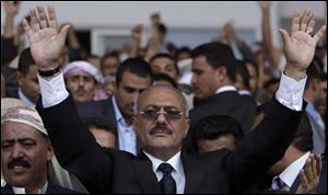In this photo from  April 15, Yemeni President Ali Abdullah Saleh waves to his supporters during a rally in Sanaa,Yemen.  Yemen's embattled president Saleh agreed Saturday to a proposal by Gulf Arab mediators to step down within 30-days and hand power to his deputy in exchange for immunity from prosecution, a major about-face for the autocratic leader who has ruled for 32-years.  