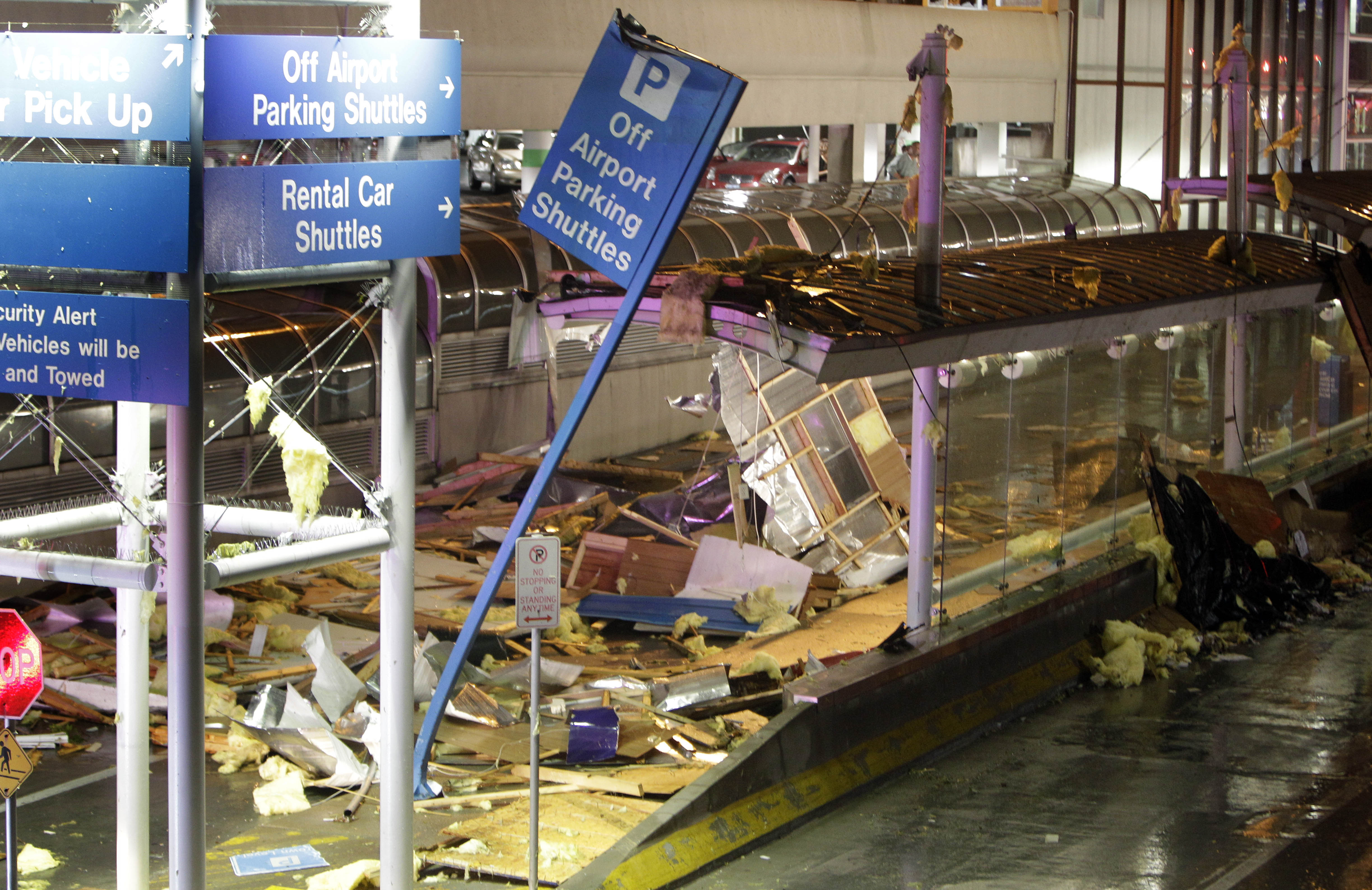 Lambert Airport in St. Louis closed, crews clean up after tornado leaves damage and injuries ...