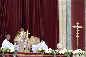 Pope Benedict XVI, second from left, delivers his blessing during the 