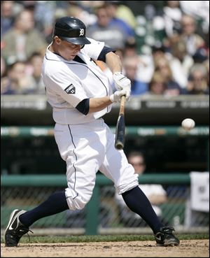 Detroit’s Brandon Inge drives a ball into left for a double, scoring Alex Avila in the sixth inning.