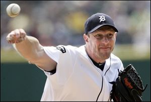 Tigers pitcher Max Scherzer struck out seven in earning the win over Chicago on Sunday.