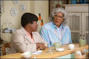 Shirley (Loretta Devine), left, and Madea (Tyler Perry) plot to get Shirley’s three adult children together to
hear some news in ‘Madea’s Big Happy Family.’