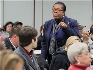 Paula Hicks-Hudson speaks at a community meeting to discuss safety and crime in District 4. 
