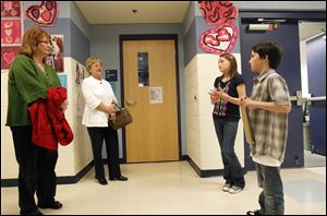 Students Carl Fry and Maddy Hodgson talk about their school to visitors Pat Linkous and Michele Harrington last week.