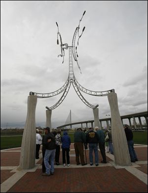 A sculpture honors the five workers who lost their lives while helping build the Veterans' Glass City Skyway.
