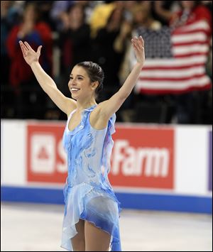 Alissa Czisny acknowledges the crowd after her performance during the women's free skate program in the U.S. Figure Skating Championships on Jan. 29 in Greensboro, N.C.