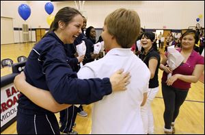 UT player Courtney Ingersoll, left,  is greeted by Nicholas Jensen, 13, an 8th grader at East Broadway Middle School.