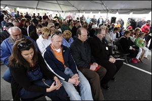 A large crowd paid tribute Thursday to the workers who helped build the Veterans' Glass City Skyway, especially the five trade workers who died during its construction.