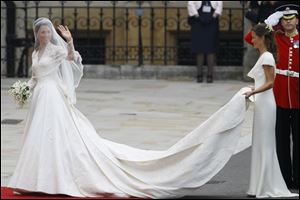 Kate Middleton is accompanied by maid of honor Pippa Middleton, right, as she arrives at Westminster Abbey.