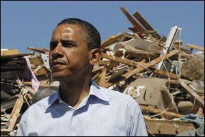 President Obama visits tornado damage in the Alberta neighborhood in Tuscaloosa, Ala., on Friday.
