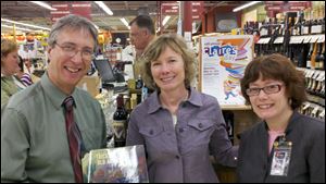 Dominic Catalano, Julie Rubini, and Mary Chwialkowski attend a wine-tasting to benefit the Library Legacy Foundation of the Toledo Lucas County Public Library and Claire's Day Ind.