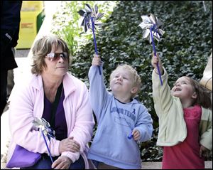Bev Pack of Oregon watches as her grandson, Gabriel Terry, and neighbor, Danika Miller, at the event.

