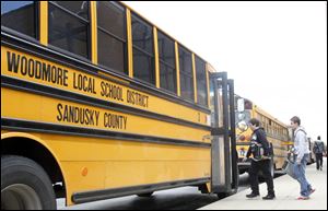Woodmore High School students head for their ride home at the end of a recent school day. If an emergency levy for the district fails on Tuesday, transportation of high school students could be eliminated.