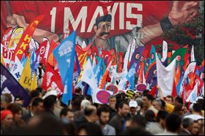 Turkish workers and activists gather for the celebrations marking May Day in Istanbul Sunday. Activists flooded Turkey's largest city Istanbul Sunday and marked international workers' day around the world with marches demanding more jobs, better working conditions and higher wages. 