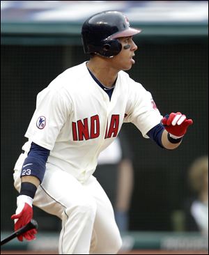 Cleveland Indians' Michael Brantley watches his ball after hitting a one-run single off Detroit Tigers relief pitcher Joaquin Benoit in the eighth inning of a baseball game on Sunday, May 1, 2011, in Cleveland. Shelley Duncan scored on the play. The Indians won 5-4.