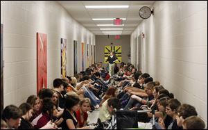 Teacher Christa Leopold counts the students lining a hallway of Maumee High School during a tornado
warning. The 17 tornadoes in Ohio so far in 2011 have surpassed the state’s annual average of 15.