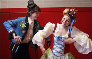 Derek Kastner, left, and Elizabeth Riddle, right, both of Sylvania perform a scene from 'Chitty Chitty Bang Bang.'