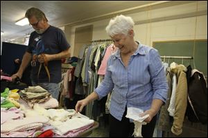 Walt Ballentine, left, looks at belts while his wife C.C. Ballentine looks at hankies.