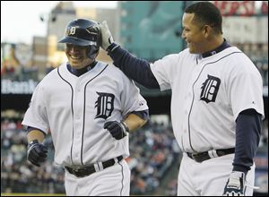Detroit Tigers' Magglio Ordonez, is congratulated by teammate Miguel Cabrera after his two run home run during the third inning of Wednesday night's game against the Yankees.