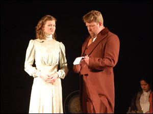The scene is Inspector Ruffing (Jason Wells-Jensen) questions Gillian Ravenscroft (Grace Easterly) in a scene from the Black Swamp Players' production of 'Ravenscroft.'