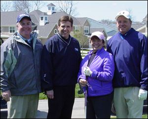 Gordon MacRitchie, Bill Kitson, Alison Falls, and Tom Manahan at the Ottawa County United Way Golf Invitational.