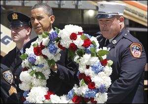 President Barack Obama prepares to lay a wreath at the National Sept. 11 Memorial at Ground Zero in New York on Thursday.
