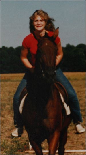 Lori Ann Hill is shown riding a horse in 1985.