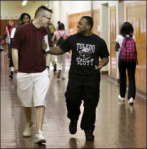 Fred Hitt, left, and Denzel Moore, students at Scott High School, have defied the odds and overcome personal hardships as they pursue their educations in the Toledo Public School system.