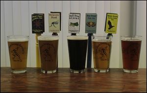 Great Black Swamp Brewing Co, brews five beers on a regular basis, in addition to seasonal varieties. The beers are, from left, Sandpiper Golden Ale, Mosquito Red, Bull Frog Stout, Bay Front Pale Ale, and Wild Duck IPA.