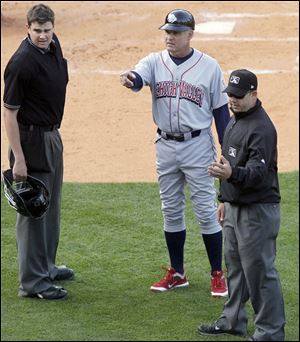 Lehigh Valley manager Ryne Sandberg offers his view to the umpires after one of his players was ejected Monday night at Fifth Third Field.