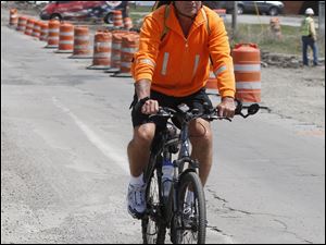 Mark Makulinski pedals along Matzinger Road on his way to work from his Lambertville home.
