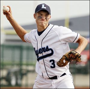 Lake pitcher Josh Tantari (3) makes a throw to first base against Elmwood.