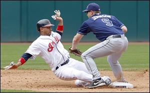 Cleveland Indians base runner Orlando Cabrera is picked off second by Tampa Bay Rays second baseman Elliot Johnson in the sixth inning of a baseball game in Cleveland on Thursday,  May 12, 2011.   (AP Photo/Amy Sancetta)