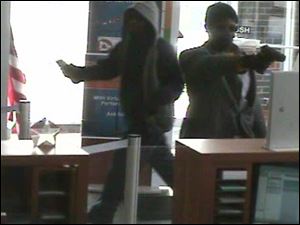 Police are looking for these two male suspects who robbed PNC Bank on Manhattan Boulevard in North Toledo.