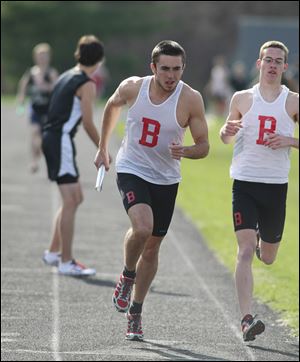 Nick Kaiser, center, helped his 3200-meter relay team win a state title last season. He won the 800 state title in 2009.