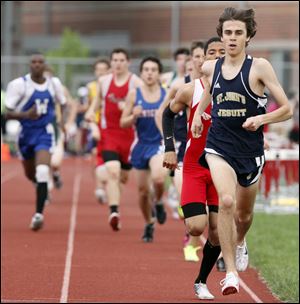Greg Turissini of St. John’s wins the 1600 meters to help the Titans claim the City League title. Turissini won the 1600 with a time of 4:23.40 and the 3200 in 9:43.79 to help the Titans nip Whitmer.