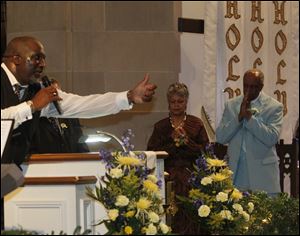Bishop Timothy Clarke of First Church of God in Columbus addresses the congregation about the Culps. The couple’s 50 years of leading the First Church of God were celebrated at the church yesterday.