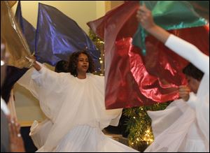 Lisa Culp leads the church’s Youth Praise Dancers during the three-hour celebration of her parents. Hundreds attended.