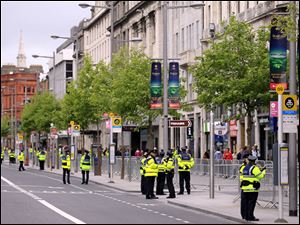 Irish Police secure the area in O'Connell Street in central Dublin, Ireland, on Tuesday ahead of Britain's Queen Elizabeth II's four-day visit, the first visit by a British Monarch in nearly 100 years.